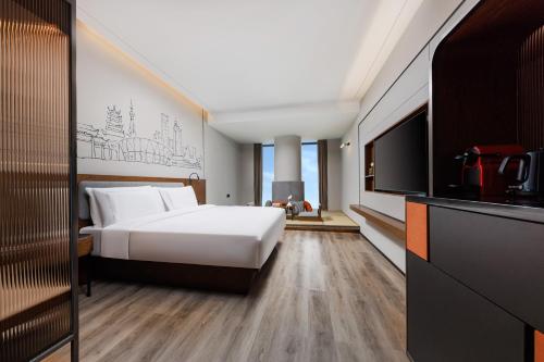 Imagen de la habitación del Hotel UrCove by Hyatt Foshan Downtown. Foto 14