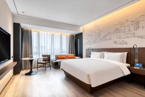 Imagen de la habitación del Hotel UrCove by Hyatt Jiashan Centre. Foto 3