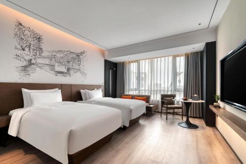 Imagen de la habitación del Hotel UrCove by Hyatt Jiashan Centre. Foto 7