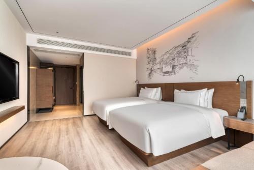 Imagen de la habitación del Hotel UrCove by Hyatt Jiashan Centre. Foto 8