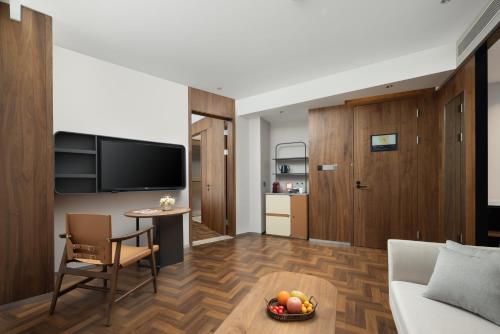 Imagen de la habitación del Hotel UrCove by Hyatt Tianjin West Railway STN. Foto 16