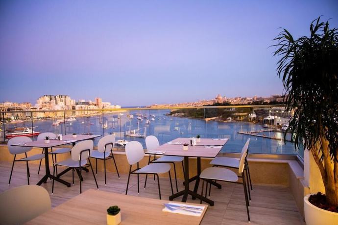 Imagen del bar/restaurante del Hotel Urban Rooms By Neu Collective. Foto 6