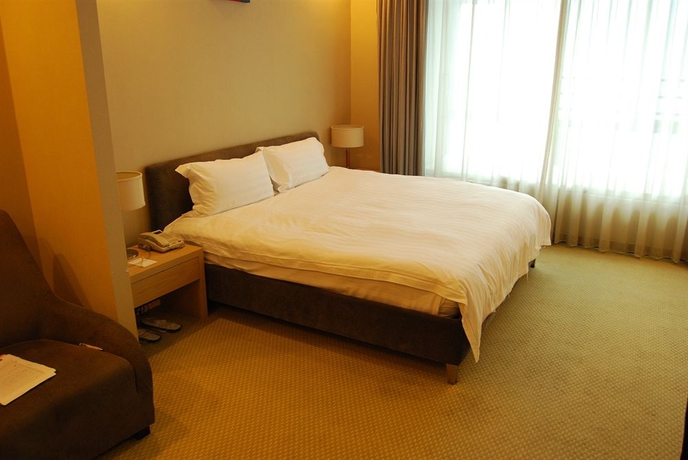 Imagen de la habitación del Hotel Urban Shanghai. Foto 3