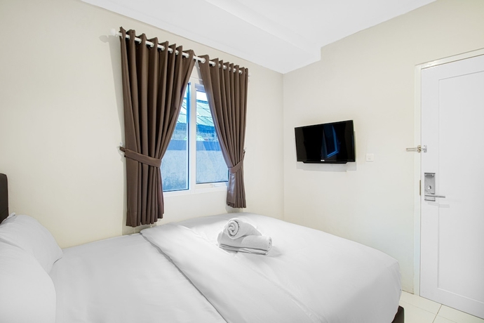 Imagen de la habitación del Hotel Urban24 Syariah Depok. Foto 6
