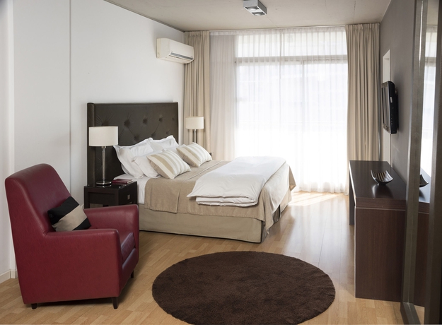 Imagen de la habitación del Hotel Urbanica Suites. Foto 12