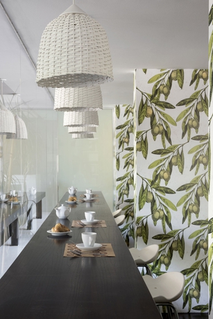 Imagen del bar/restaurante del Hotel Urbanica Suites. Foto 7