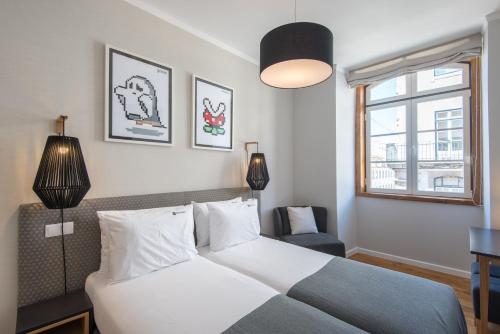 Imagen de la habitación del Hotel Urbano FLH Hotels Lisboa. Foto 7