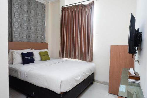 Imagen de la habitación del Hotel Urbanview Capital Makassar. Foto 19