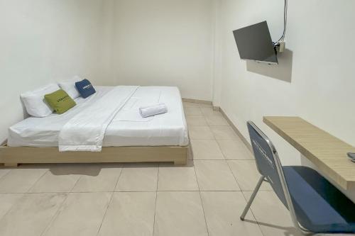 Imagen de la habitación del Hotel Urbanview Maharani Garut. Foto 20