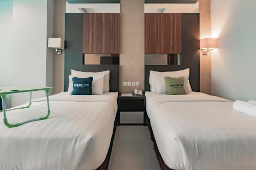 Imagen de la habitación del Hotel Urbanview Newton Riau Bandung by RedDoorz. Foto 14