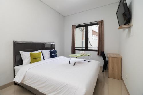 Imagen de la habitación del Hotel Urbanview Pasar Baru Jakarta. Foto 18