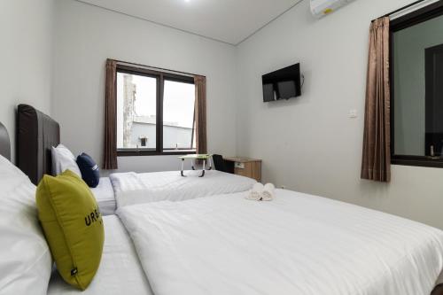 Imagen de la habitación del Hotel Urbanview Pasar Baru Jakarta. Foto 19