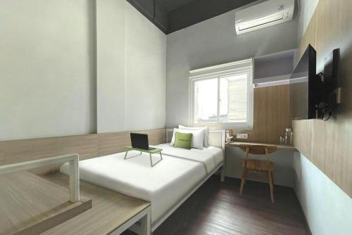 Imagen de la habitación del Hotel Urbanview The Tang Balikpapan. Foto 12