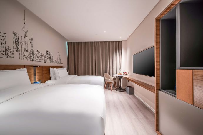 Imagen de la habitación del Hotel Urcove By Hyatt Shanghai Wujiaochang. Foto 9