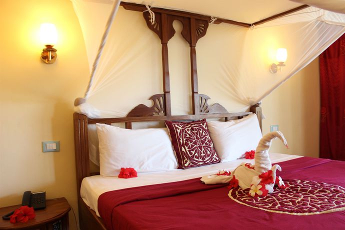 Imagen de la habitación del Hotel Uroa Bay Beach Resort. Foto 6