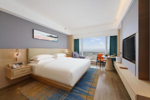 Imagen de la habitación del Hotel Urumqi Luolan. Foto 18