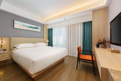 Imagen de la habitación del Hotel Urumqi Luolan. Foto 19