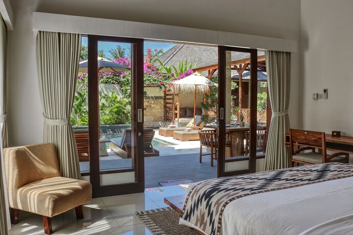 Imagen de la habitación del Hotel Utara Villas. Foto 17