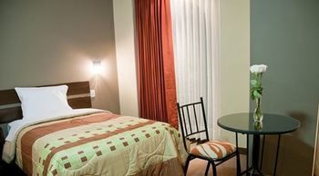 Imagen de la habitación del Hotel Utasa Inn. Foto 13