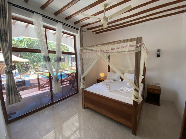 Imagen de la habitación del Hotel Utulivu Bungalow. Foto 17