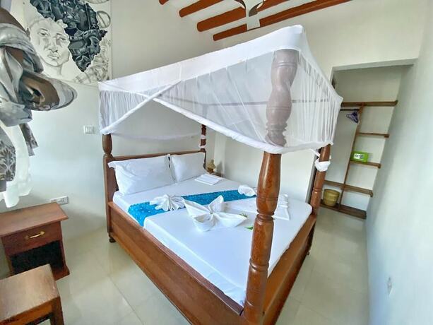 Imagen de la habitación del Hotel Utulivu Bungalow. Foto 18