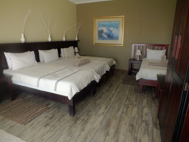 Imagen de la habitación del Hotel Uzuri Guesthouse. Foto 18