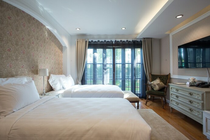Imagen de la habitación del Hotel V Heritage Villa Chiang Mai. Foto 6