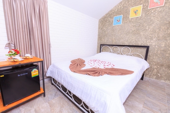 Imagen de la habitación del Hotel V Village. Foto 7