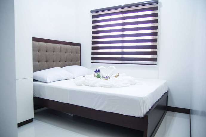 Imagen de la habitación del Hotel V and G Suites Limay. Foto 15