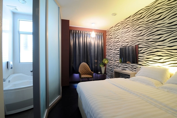 Imagen de la habitación del Hotel V3 Taman Gaya. Foto 8
