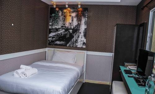 Imagen de la habitación del Hotel V30 Sukhumvit. Foto 11