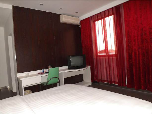 Imagen de la habitación del Hotel V8 Xi Lang Branch. Foto 6