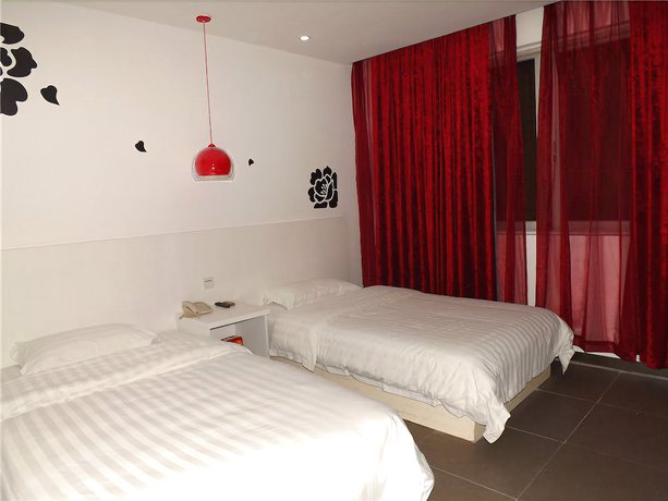 Imagen de la habitación del Hotel V8 Xi Lang Branch. Foto 7