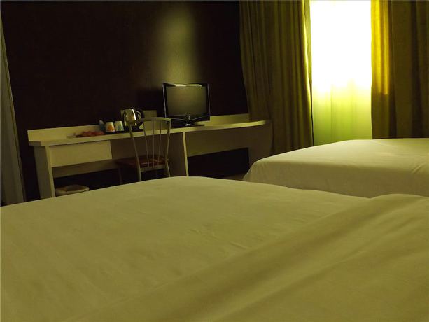 Imagen de la habitación del Hotel V8 Xi Lang Branch. Foto 9