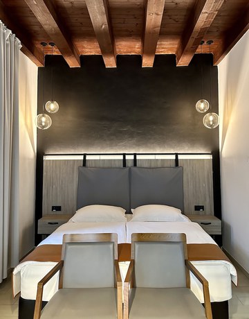Imagen de la habitación del Hotel VENEZIANA Boutique Superior. Foto 11