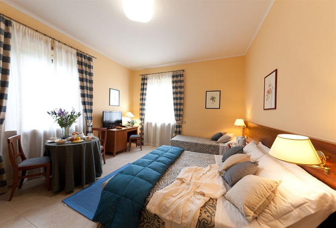 Imagen de la habitación del Hotel VICTOR, Osteria del Curato. Foto 9