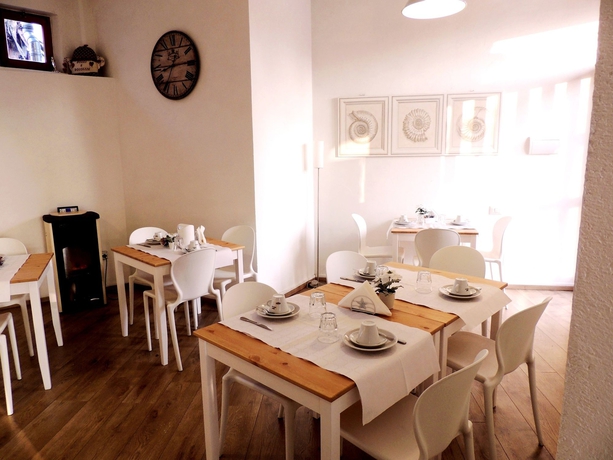 Imagen del bar/restaurante del Hotel VILLAGGIO LE MIMOSE. Foto 5
