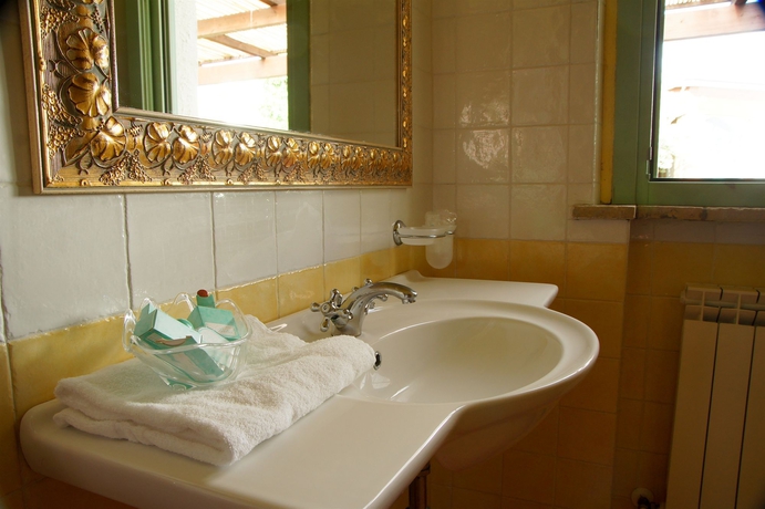 Imagen de la habitación del Hotel VILLAGGIO LE MIMOSE. Foto 12
