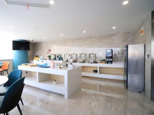 Imagen general del Hotel VX Jiangsu Taizhou Xinghua RT-Mart. Foto 4