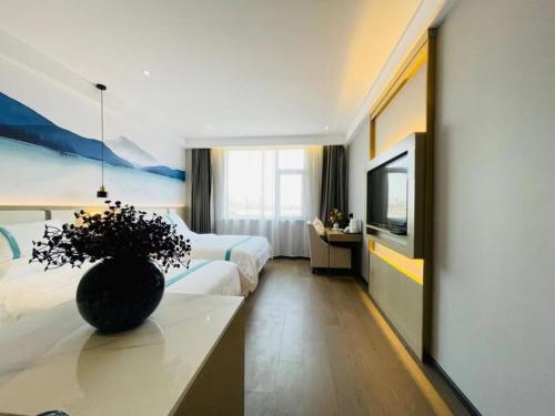 Imagen de la habitación del Hotel VX Xiao County Railway Station Century Avenue zheshang Market. Foto 19