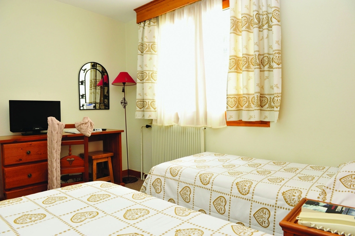 Imagen de la habitación del Hotel Vacances Bleues Les Chalets Du Prariand. Foto 11