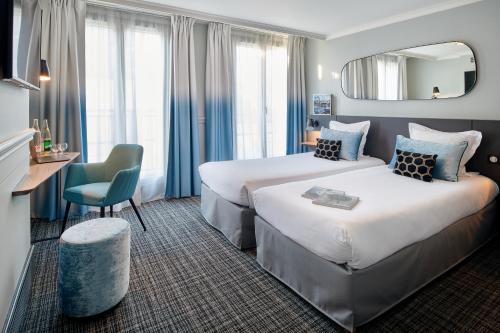 Imagen de la habitación del Hotel Vacances Bleues Provinces Opera. Foto 2