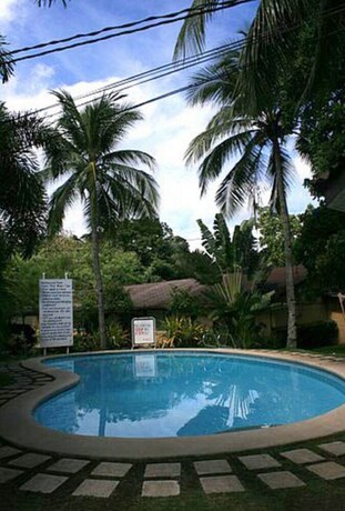 Imagen de la piscina del Hotel Vacation Villas At Subic Homes. Foto 31