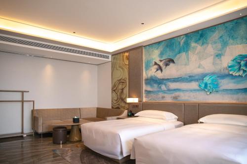 Imagen de la habitación del Hotel Vaperse Hainan Clear Water Bay. Foto 11