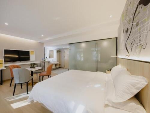 Imagen de la habitación del Hotel Vatica Shuyang Central Mall Nanjing Road. Foto 14