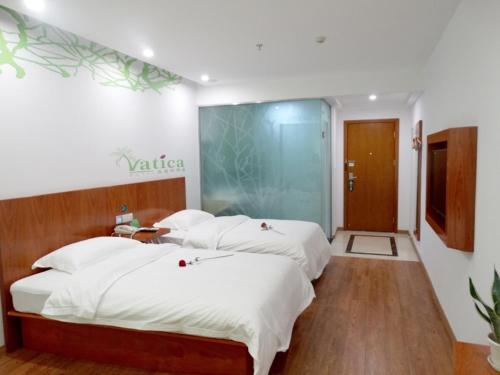 Imagen de la habitación del Hotel Vatica Suzhou Changshu Shimao Residence. Foto 12