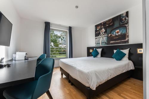 Imagen de la habitación del Hotel Velotel Brugge. Foto 2