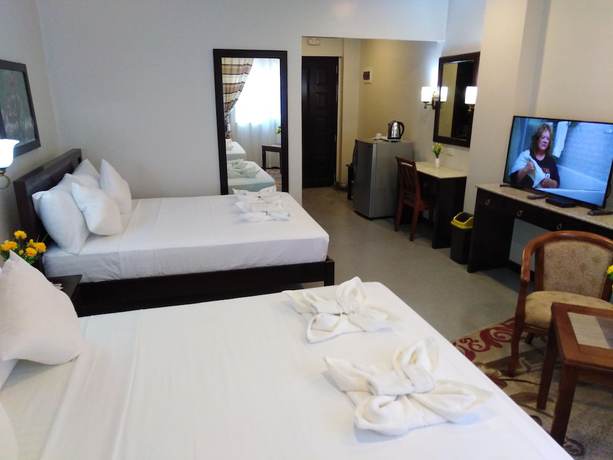 Imagen de la habitación del Hotel Venezia Suites Iloilo. Foto 2