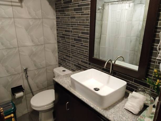Imagen de la habitación del Hotel Venezia Suites Iloilo. Foto 5