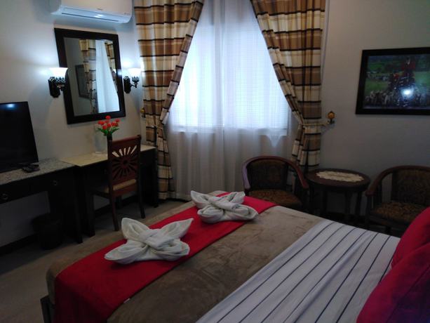 Imagen de la habitación del Hotel Venezia Suites Iloilo. Foto 8